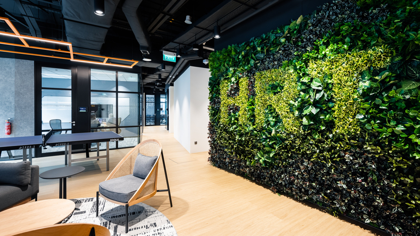 Hudson River Trading's office. On the wall is a hedge with "HRT" on it.