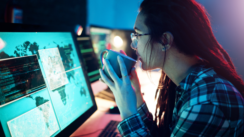Computer screen, coffee or cyber security woman hacker in dark room for coding.