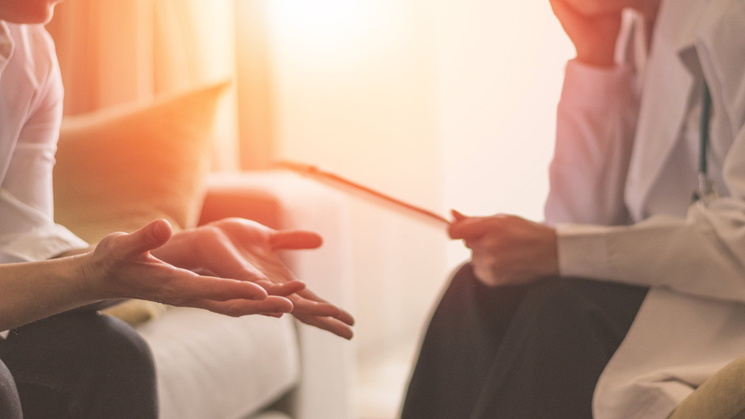 A patient talks with a therapist.