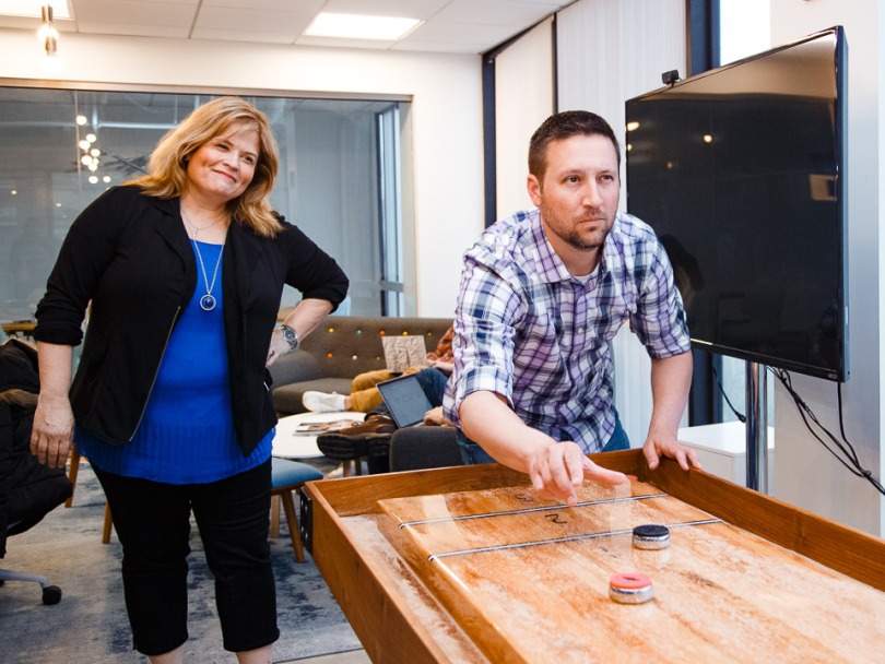 Jason Moens plays shuffleboard 