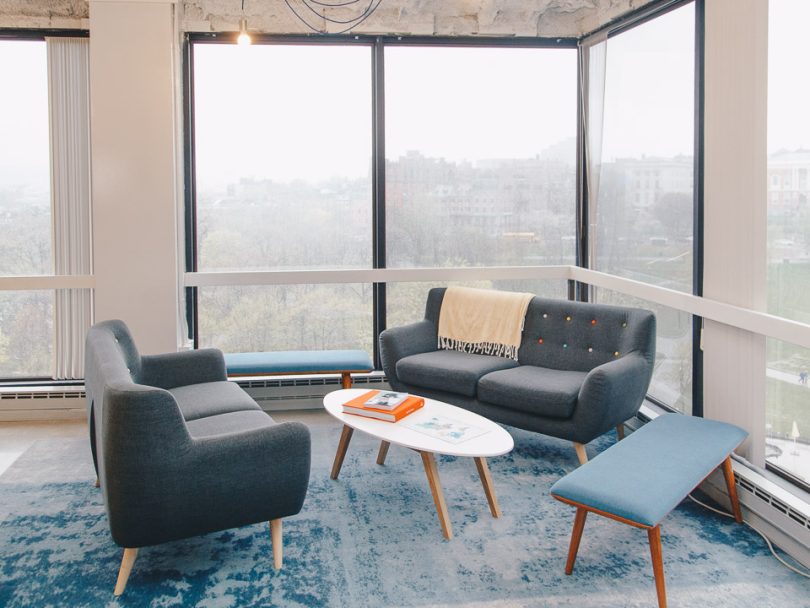 Seating space with windows at Flywheel office
