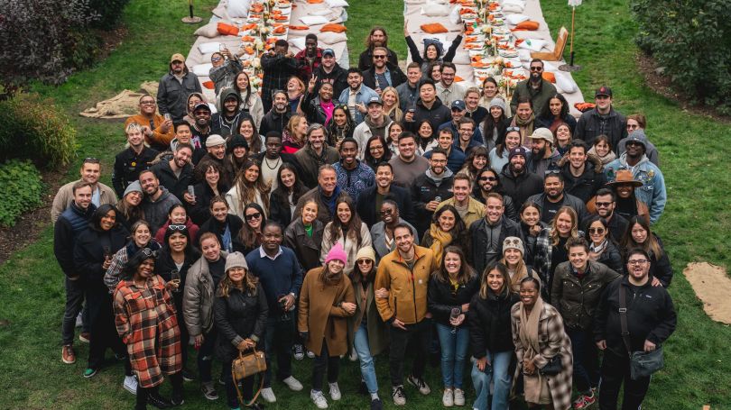 A group photo outdoors at the Melio company picnic. 
