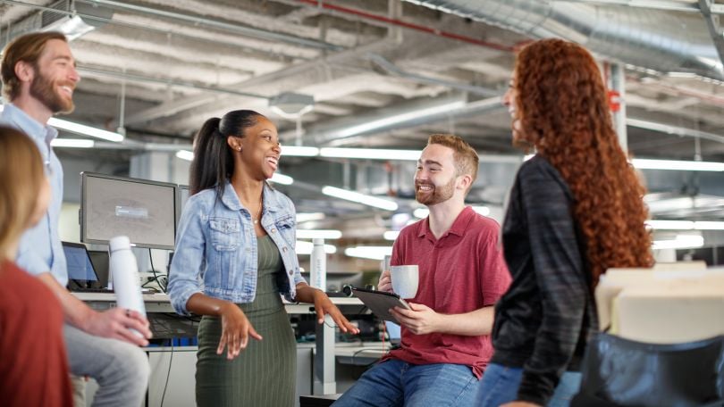 VelocityEHS employees chat animatedly.