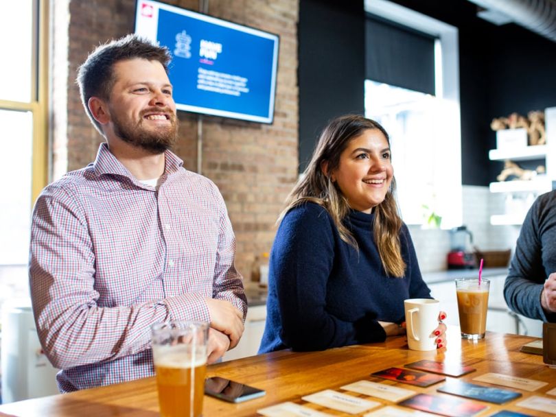Devbridge employees drink coffee