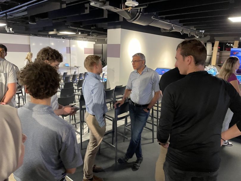  Magna International CEO Swamy Kotagiri talking with interns at an event