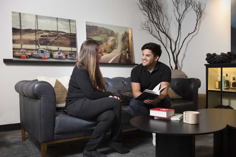 devbridge team talking on couch 