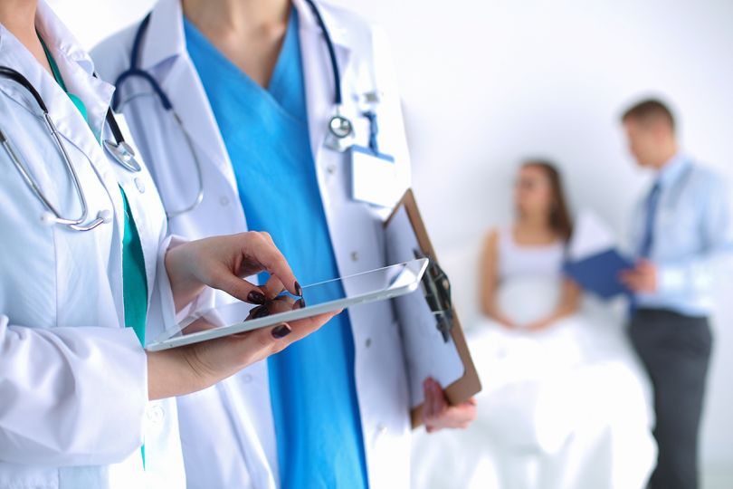 Woman doctor holding a digital tablet