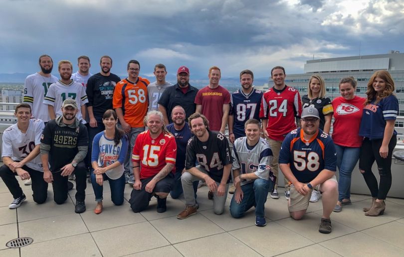 Adtaxi team members at football game