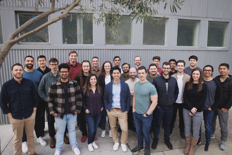 The Adept team stands together outside for a group photo.
