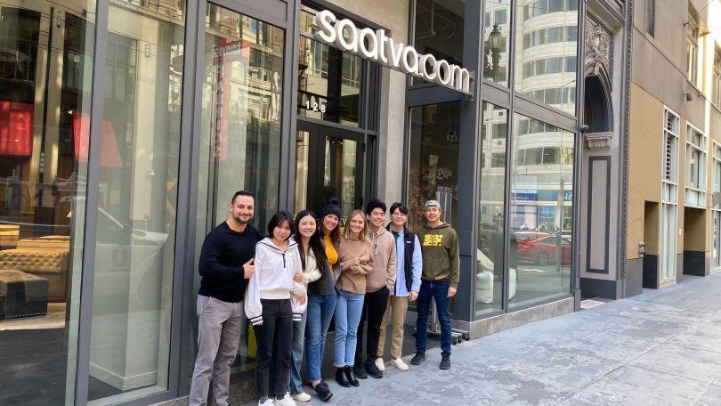 Saatva’s analytics team poses for a photo outside of the office. 