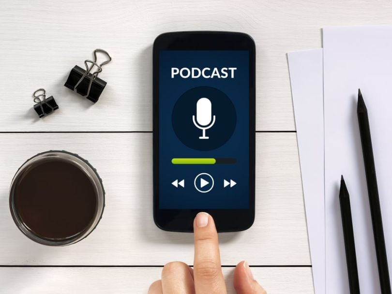 A phone playing a podcast