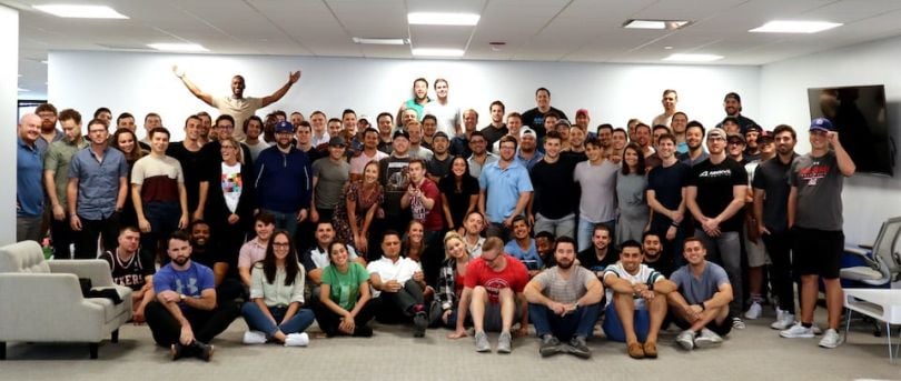 Arrive Logistics team taking group photo in office