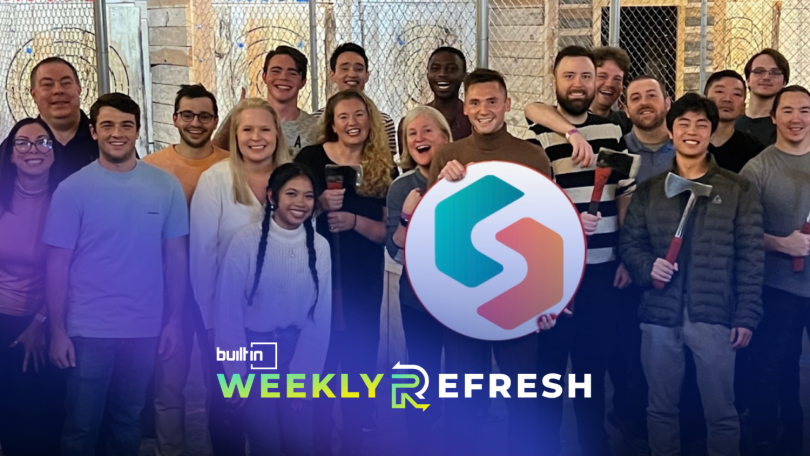 The Sandbox Banking team poses for a photo holding the company's logo.