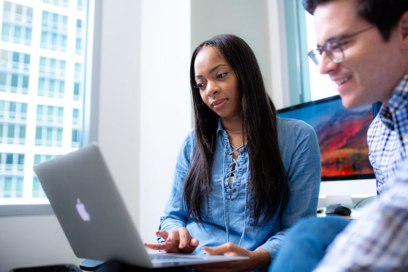 Two Bento for Business staff working on a computer 