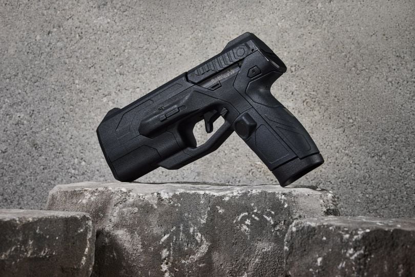 The Biofire Smart Gun leaning on a rock.