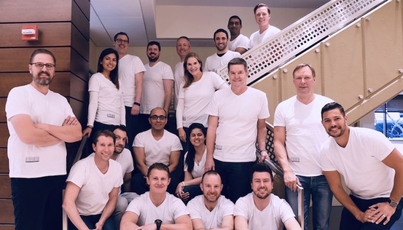 Bringg team in matching shirts taking a group photo