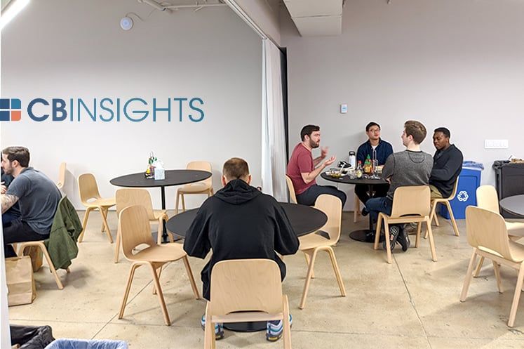 CB Insights team members having lunch together in the office