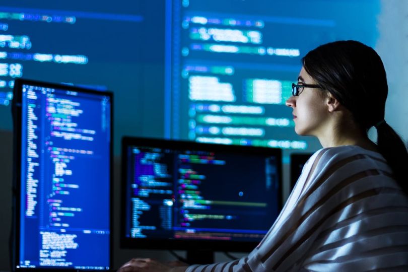 Woman software engineer working on a computer