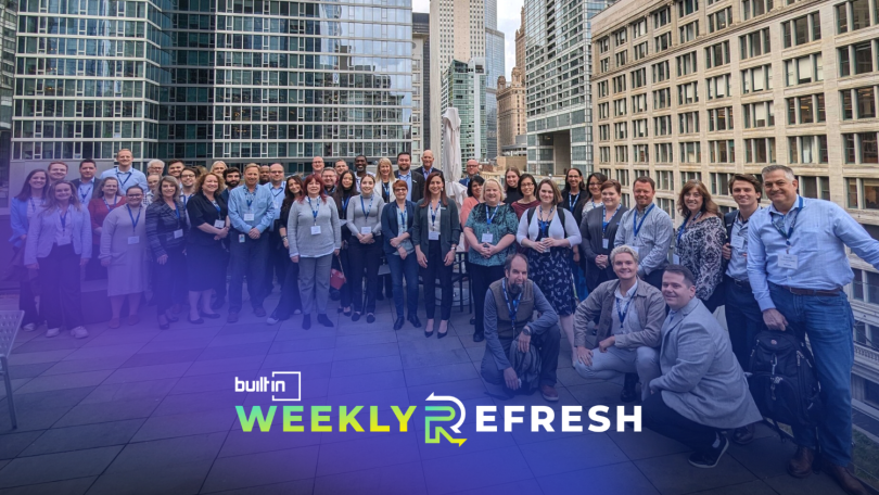 Members of the Fusion team pose for a group photo on rooftop patio.