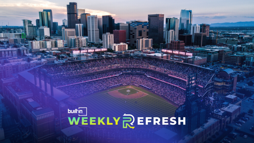 An aerial photo of the Denver skyline and Coors Field at sunset. 