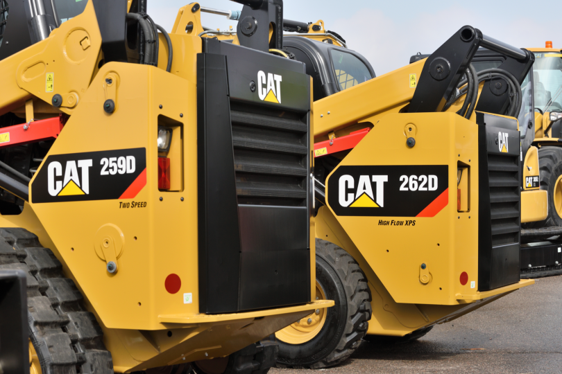 Caterpillar equipment seen outside.