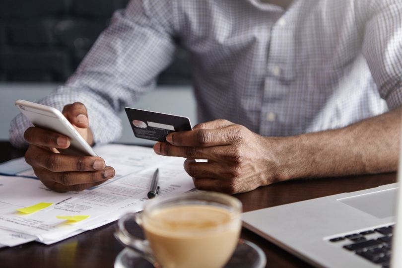A man making an online purchase on his smartphone