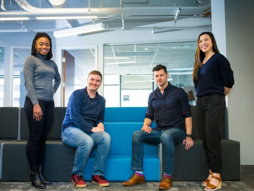 CityBase leaders posing in their office