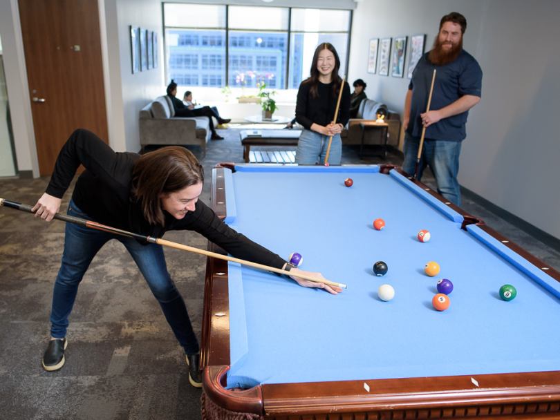 CityBase team playing pool