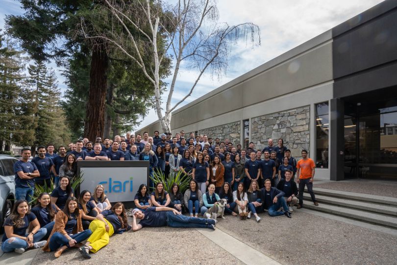 Clari team standing outside headquarters.