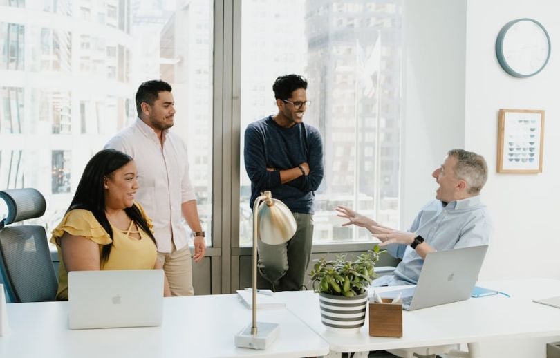 Clearcover staff chatting in a conference room