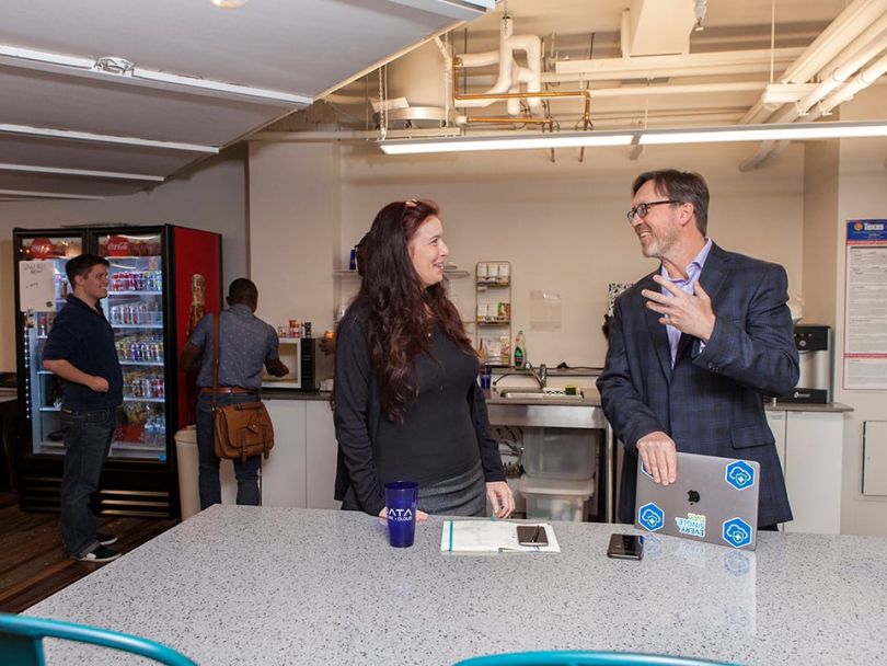 ClearDATA's CEO and senior product manager collaborating in the office