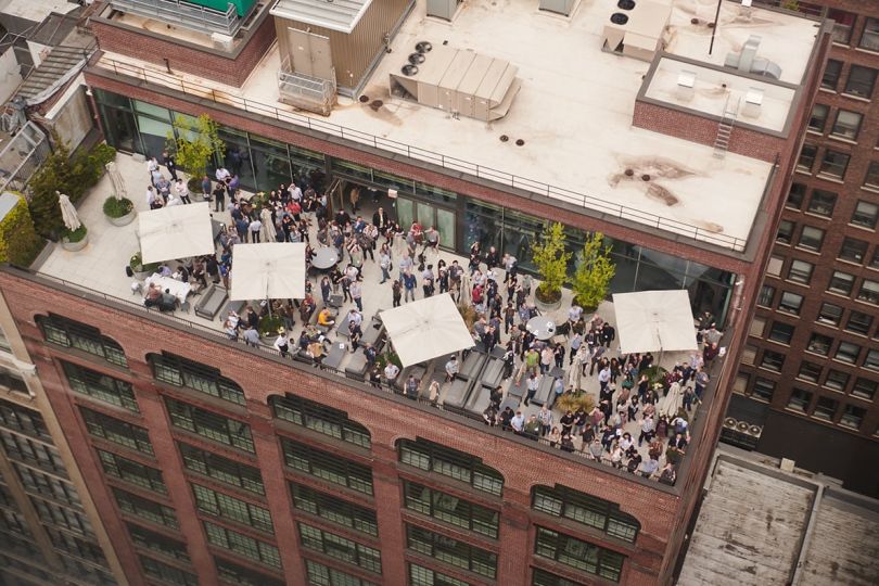 Aerial view of Cockroach Labs team members on a rooftop patio
