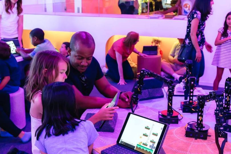 Codeverse trainer working with kids in lab