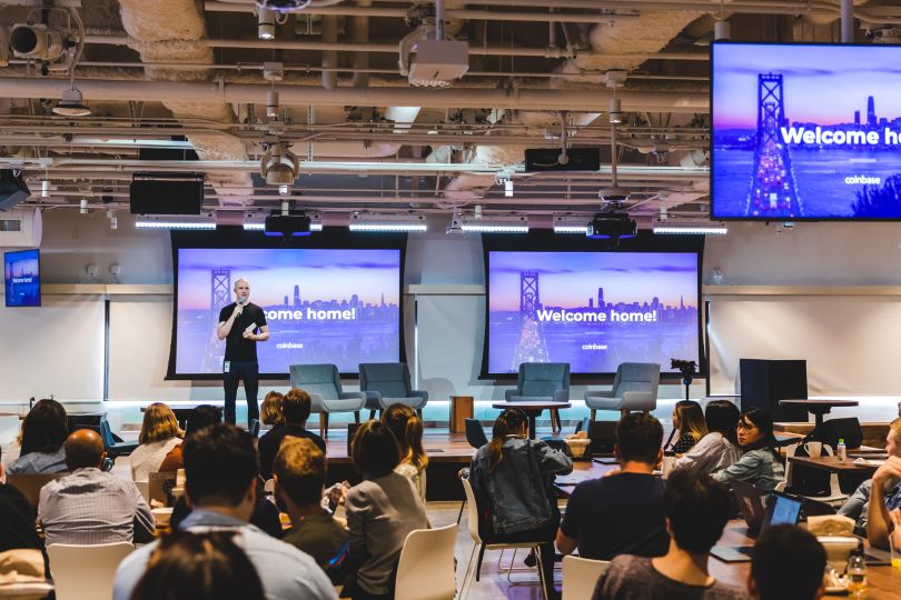 An employee at Coinbase presenting to the team.