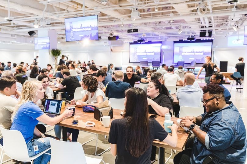 Coinbase team members in an all hands meeting