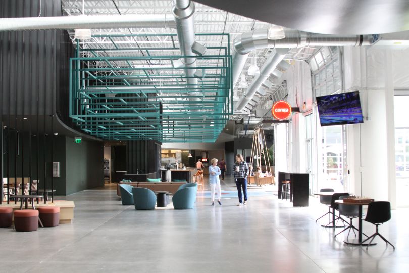 image of two people walking in an office