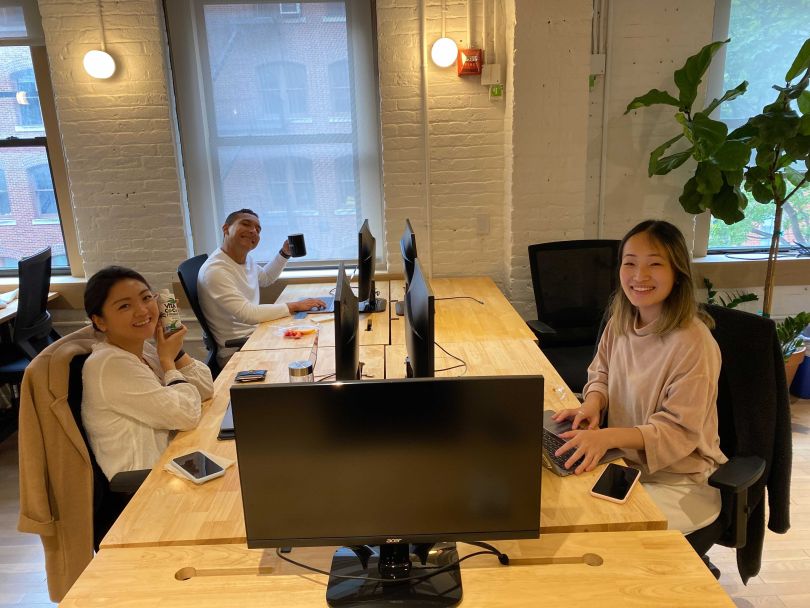 Contentsquare teammates working together at desks company office