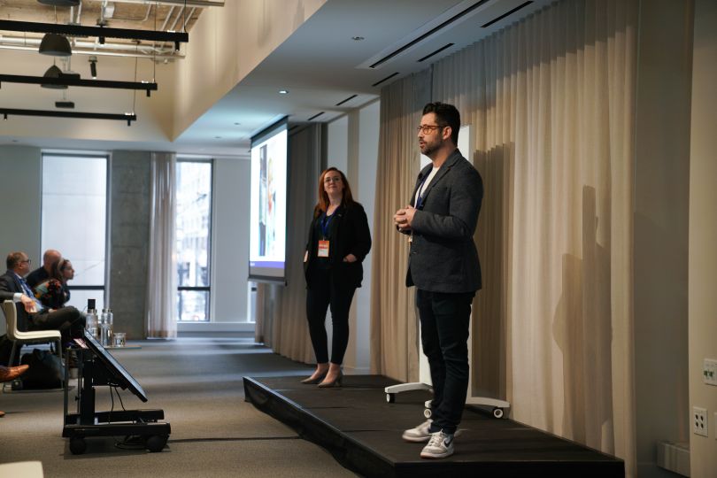 Dustin Deno speaking at an event