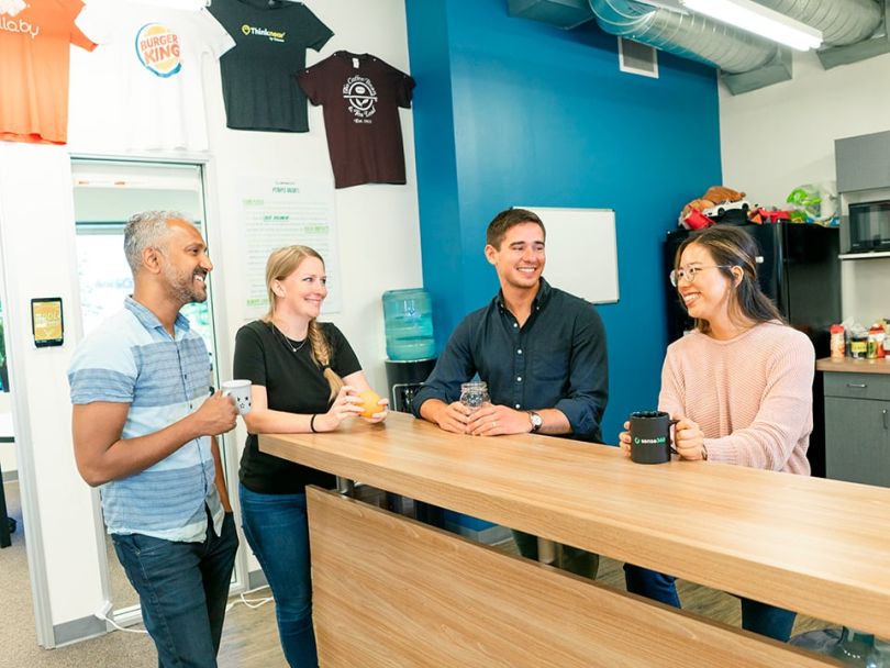 JEREMY SHAPERO in the office with his team