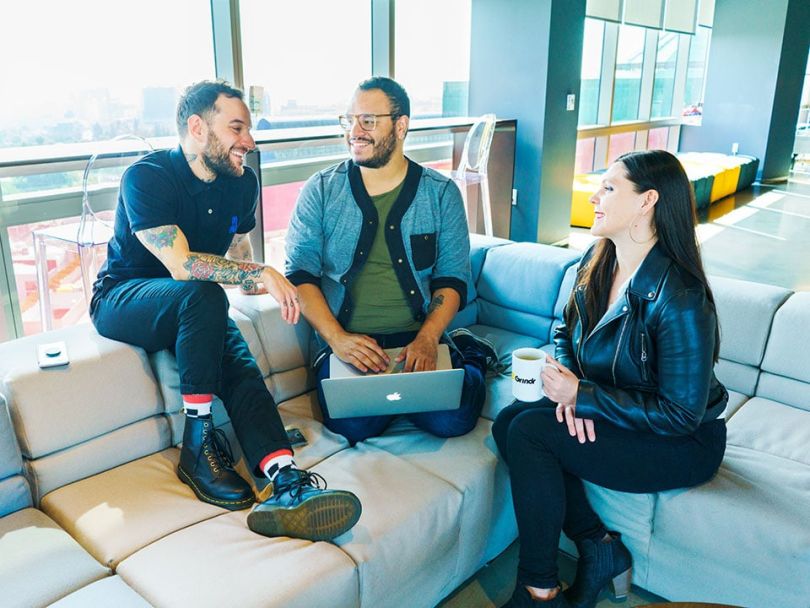 The INTO team at Grindr working together in the office
