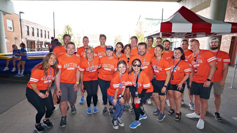 A group photo of AdAction team members at a recreational event. 