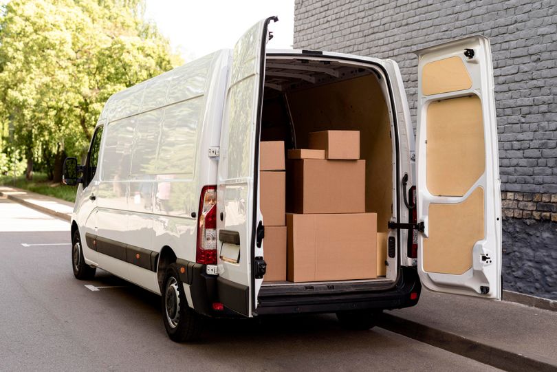 white van with delivery packages