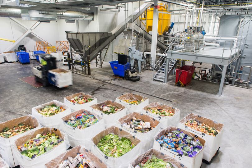 Several boxes of expired food are pictured inside Divert's anaerobic digestion facility in Freetown. 