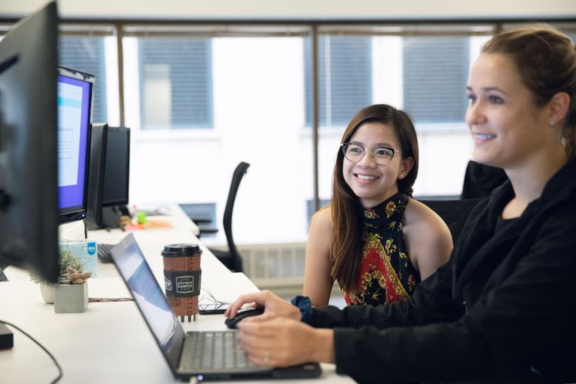 DocuSign team members working at a computer