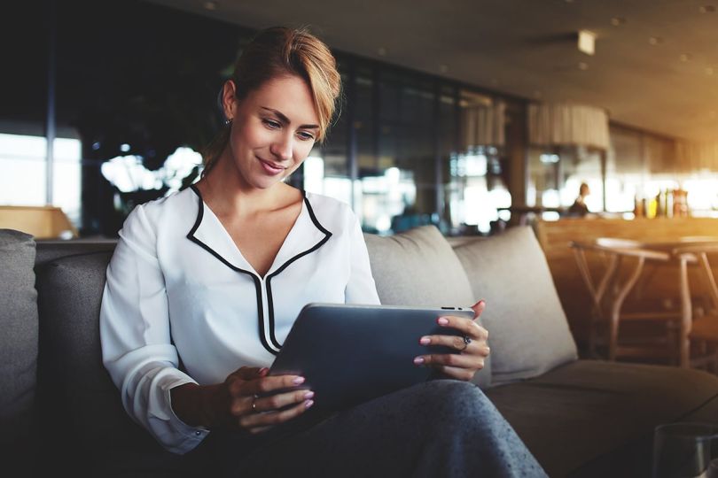 Woman reading on a digital tablet
