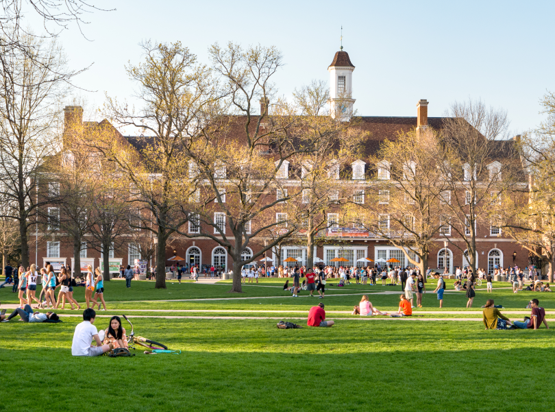 University of Illinois at Urbana-Champaign quad facing the student union. College students splayed out on the lawn.