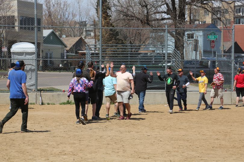 The ENGAGE team walking across a dirt field. 