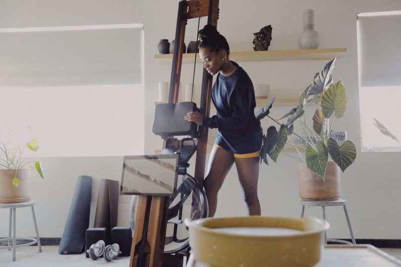 Ergatta woman using rowing machine