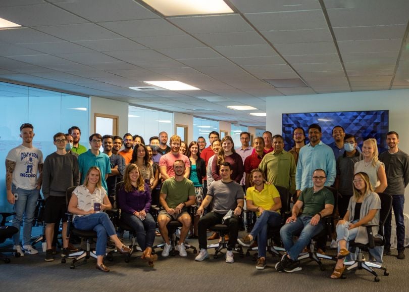 A group of Esper employees together in the office.