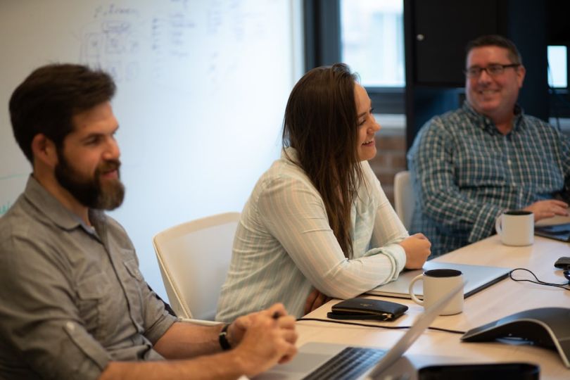 Evive team members chatting in conference room